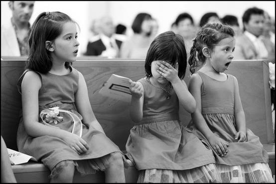 3 little girl react to the kiss at a wedding
